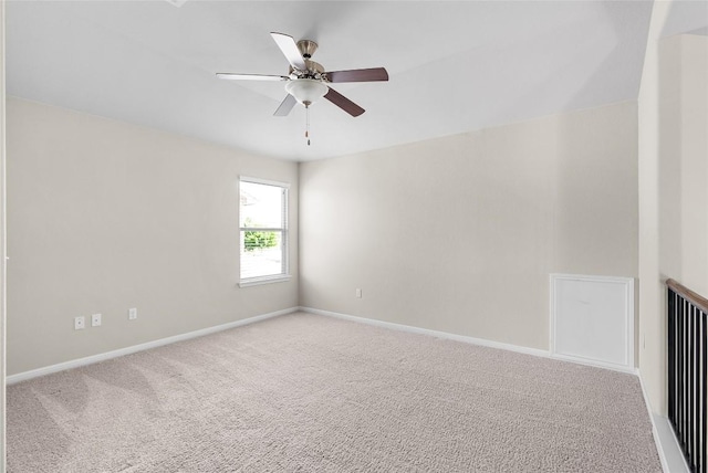 unfurnished room with baseboards, carpet flooring, and ceiling fan