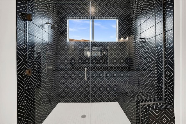 bathroom with a tile shower