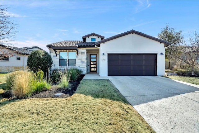 view of front facade featuring a garage and a front yard