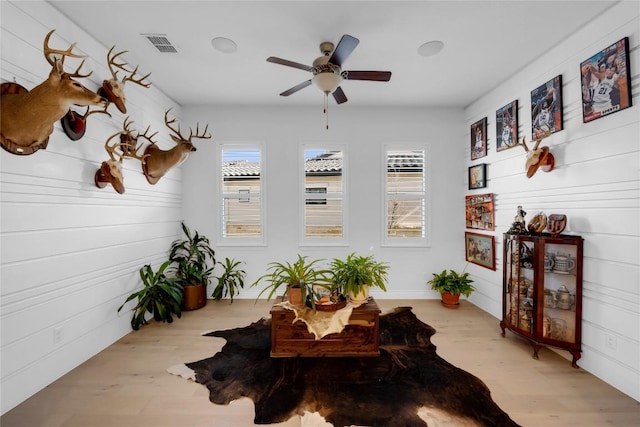 sunroom with ceiling fan and a healthy amount of sunlight