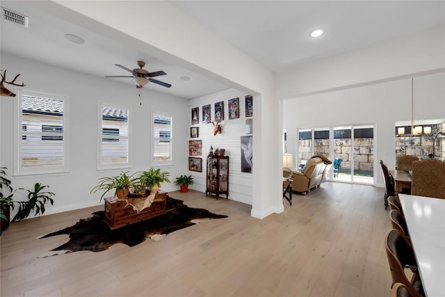 interior space with ceiling fan and light hardwood / wood-style floors