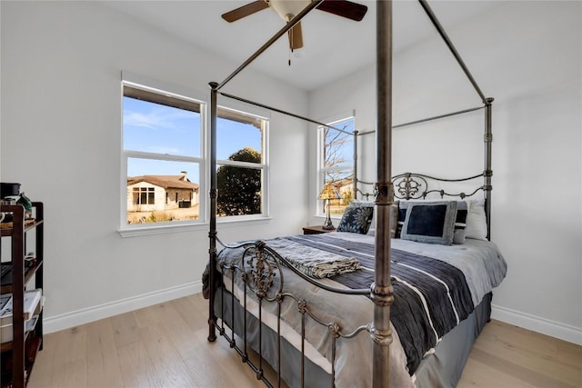 bedroom featuring ceiling fan and light wood-type flooring