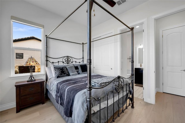 bedroom featuring a closet and light wood-type flooring