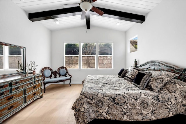 bedroom featuring lofted ceiling with beams, ceiling fan, and light wood-type flooring