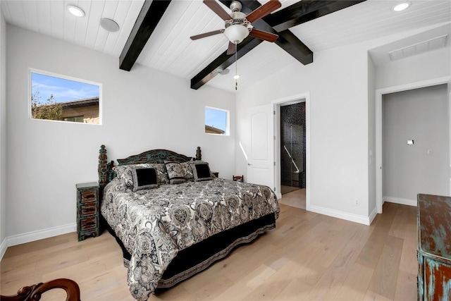 bedroom featuring ceiling fan, light hardwood / wood-style floors, and vaulted ceiling with beams