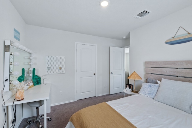 bedroom with baseboards, visible vents, and dark carpet