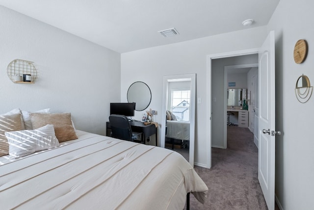 bedroom with carpet, visible vents, and baseboards