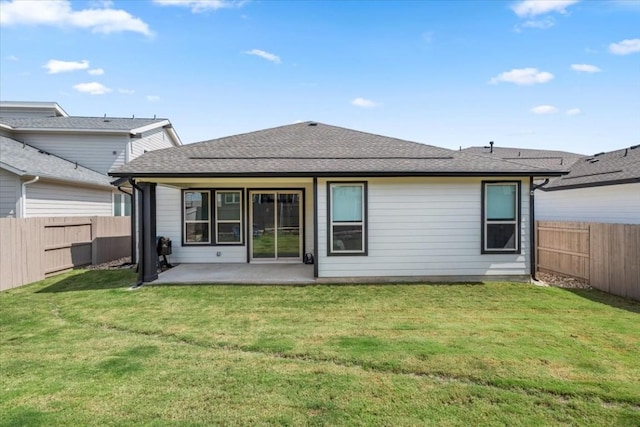 back of house featuring a yard and a patio area