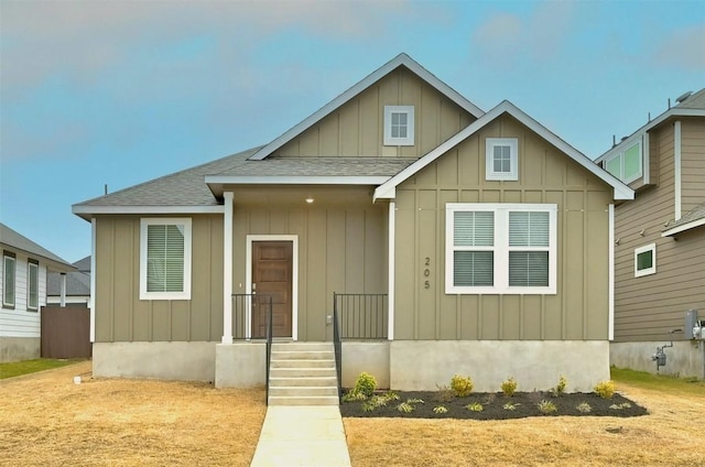 view of front of house featuring board and batten siding and a shingled roof