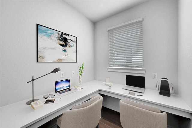 home office featuring hardwood / wood-style floors and built in desk