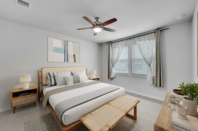 bedroom featuring baseboards, a ceiling fan, carpet flooring, and visible vents