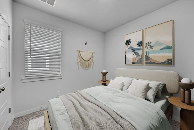 carpeted bedroom with baseboards