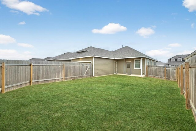205 Ashby Dr, Hutto, TX 78634 - rear view of house featuring a patio area and roof with shingles