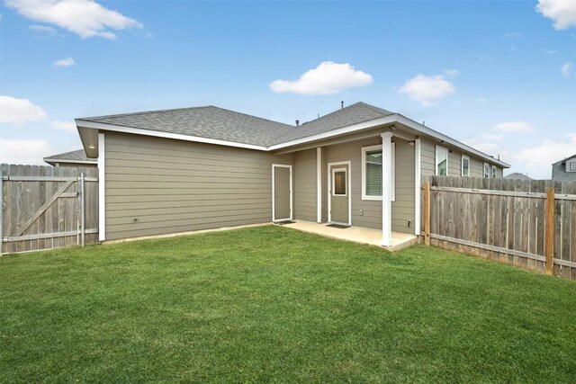 205 Ashby Dr, Hutto, TX 78634 - rear view of house with a patio and a shingled roof