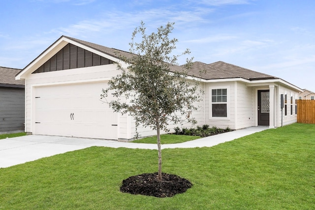 ranch-style home with a garage and a front yard