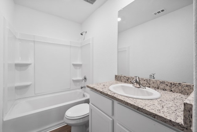 full bathroom with hardwood / wood-style flooring, vanity, bathtub / shower combination, and toilet