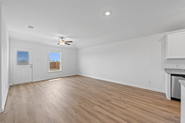 unfurnished living room featuring ceiling fan and light hardwood / wood-style floors