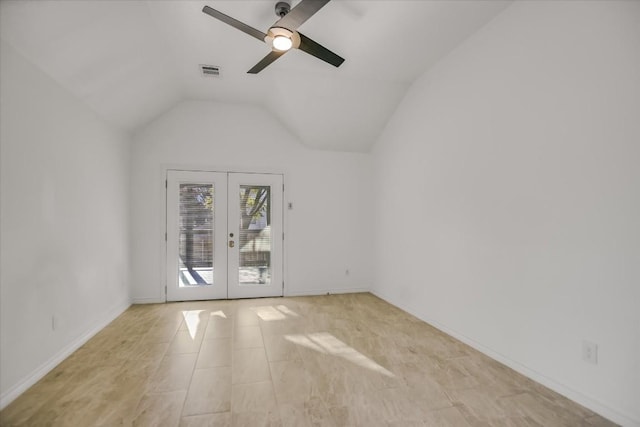 spare room featuring lofted ceiling, french doors, and ceiling fan