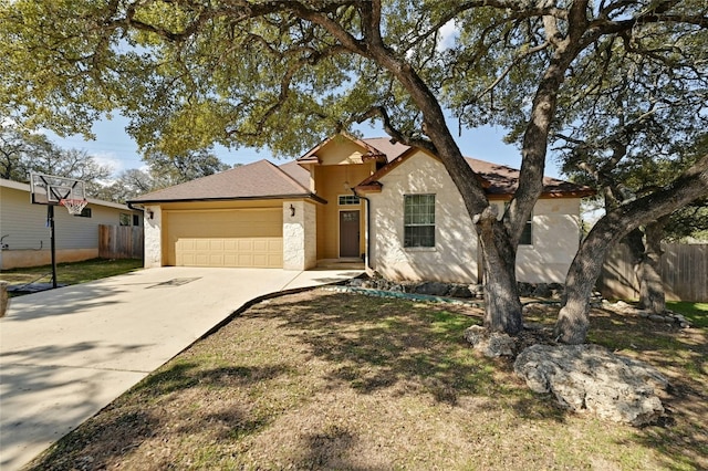 view of front facade featuring a garage and a front lawn