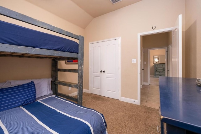 bedroom with light carpet and vaulted ceiling