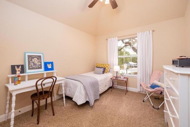 bedroom featuring ceiling fan, vaulted ceiling, and carpet