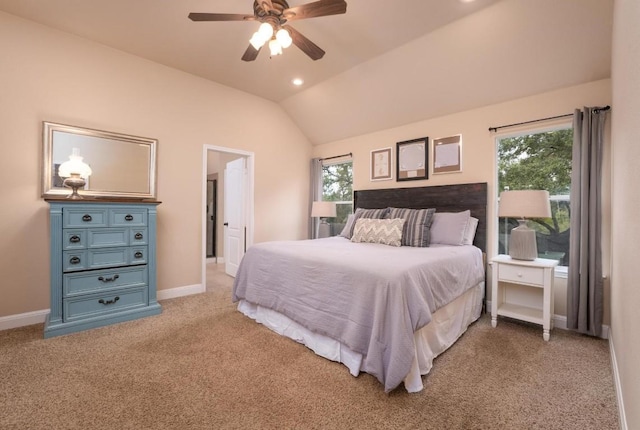 carpeted bedroom featuring vaulted ceiling and ceiling fan