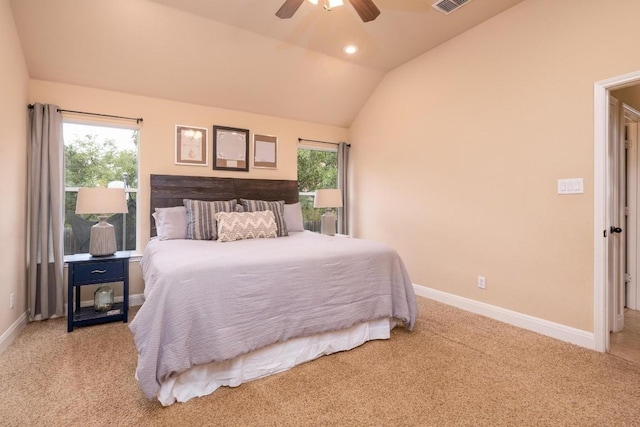 bedroom with light carpet, vaulted ceiling, and ceiling fan