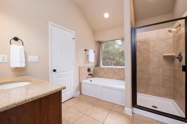 bathroom with vanity, vaulted ceiling, tile patterned floors, and separate shower and tub