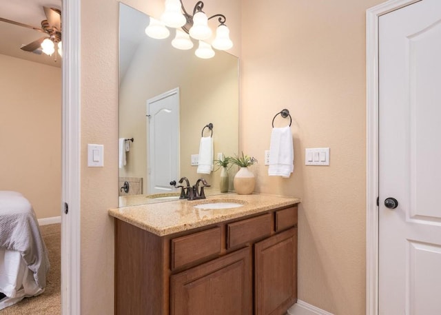 bathroom featuring ceiling fan and vanity