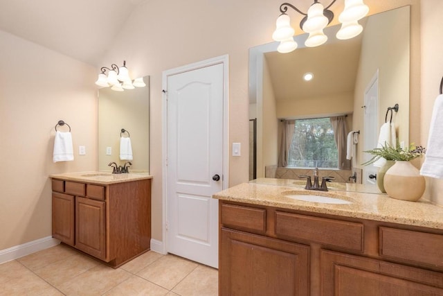 bathroom featuring lofted ceiling, vanity, tile patterned flooring, and a notable chandelier