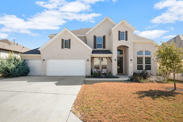 front facade with a garage and a front yard