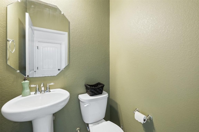 bathroom with sink and toilet