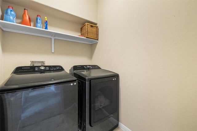 laundry room with washer and clothes dryer