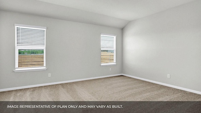 spare room featuring lofted ceiling and carpet floors