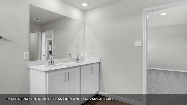 bathroom with vanity and wood-type flooring