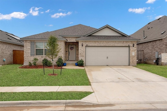 view of front of house with a garage and a front lawn