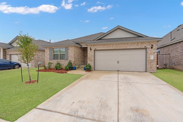 ranch-style home with a garage and a front lawn