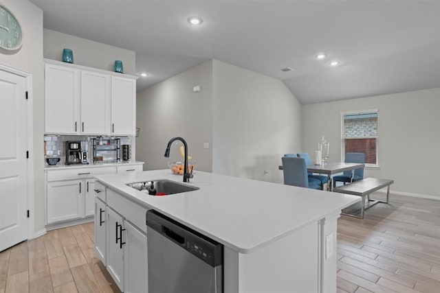 kitchen with a kitchen island with sink, white cabinets, sink, and dishwasher