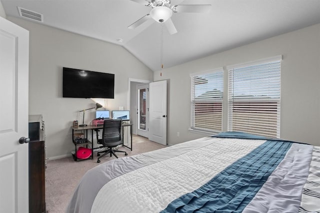 carpeted bedroom with ceiling fan and vaulted ceiling