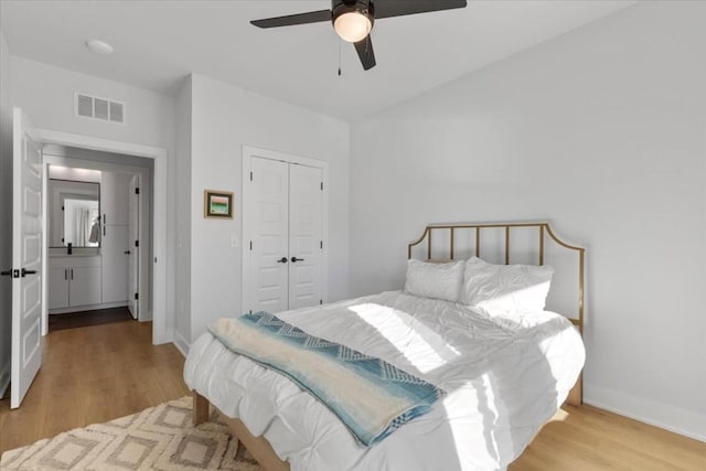 bedroom featuring a closet, ceiling fan, and light wood-type flooring