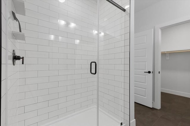 bathroom featuring tile patterned floors and walk in shower