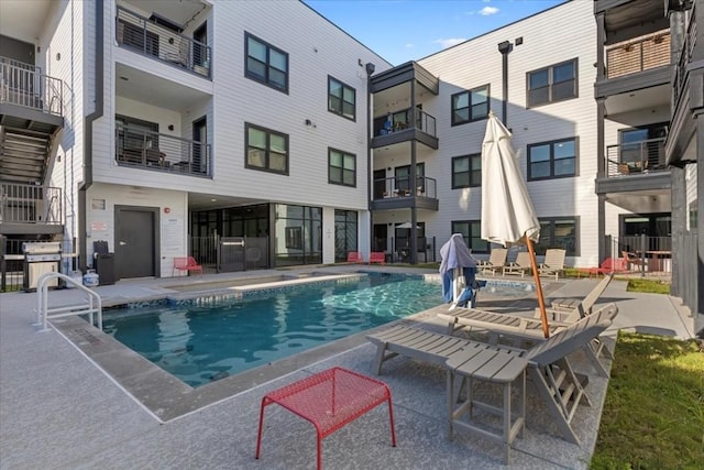 view of swimming pool with a patio area