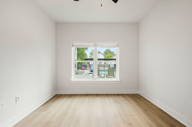 3101 Govalle Ave Unit 106, Austin, TX 78702 - empty room with light wood-style floors, baseboards, and ceiling fan