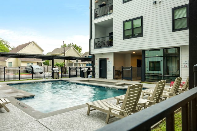 3101 Govalle Ave Unit 106, Austin, TX 78702 - community pool featuring fence, a patio area, and area for grilling