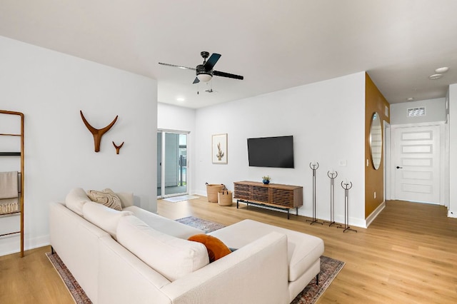3101 Govalle Ave Unit 106, Austin, TX 78702 - living room with baseboards, ceiling fan, recessed lighting, and light wood-style flooring