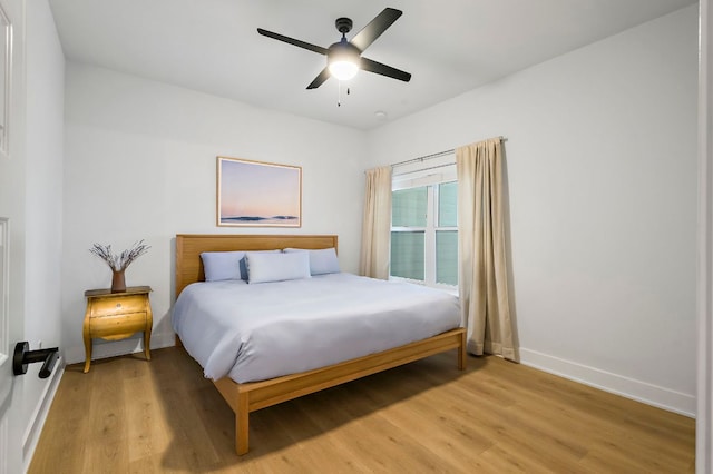 3101 Govalle Ave Unit 106, Austin, TX 78702 - bedroom with baseboards, ceiling fan, and light wood finished floors