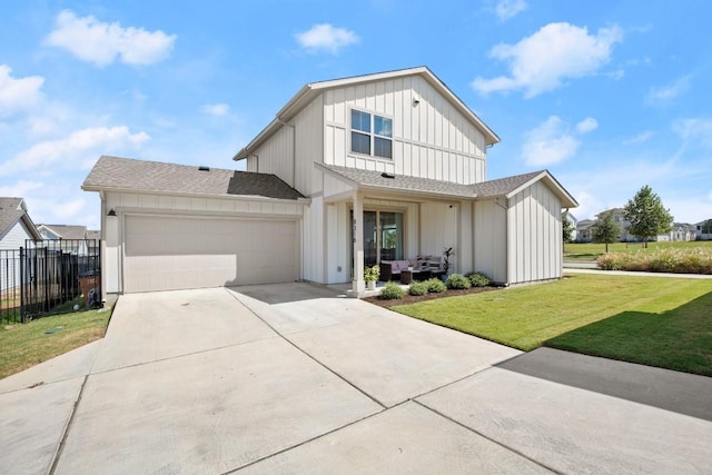 modern inspired farmhouse featuring a garage and a front lawn