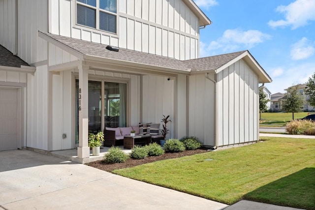 doorway to property with a yard, outdoor lounge area, and a patio