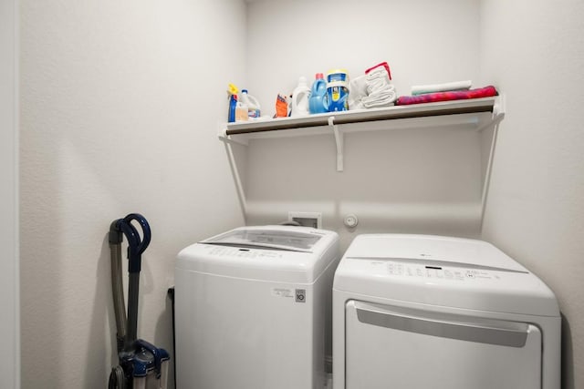 laundry room featuring washer and clothes dryer