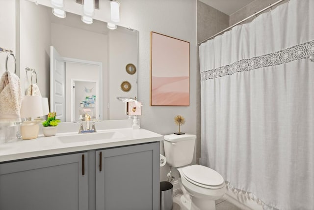 bathroom with vanity, toilet, and a shower with shower curtain